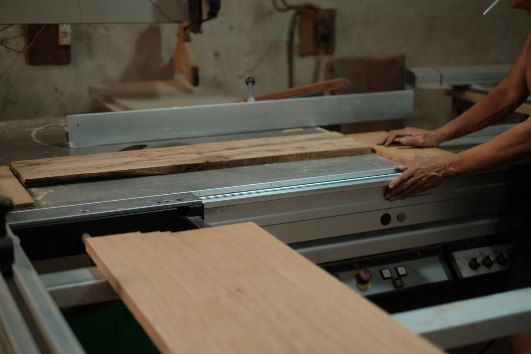 Sheet material being cut down on the panel saw before the edges are banded