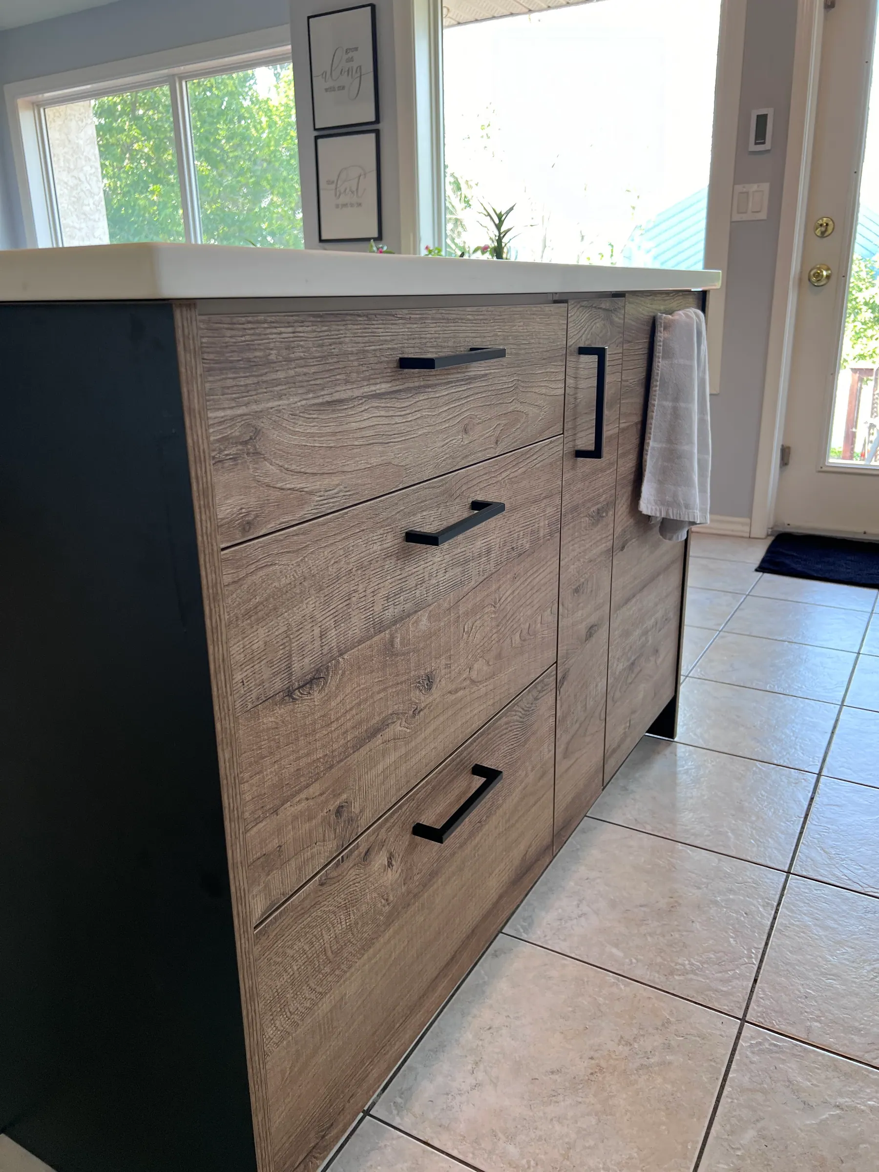 Oak-look island fronts with black bar pulls