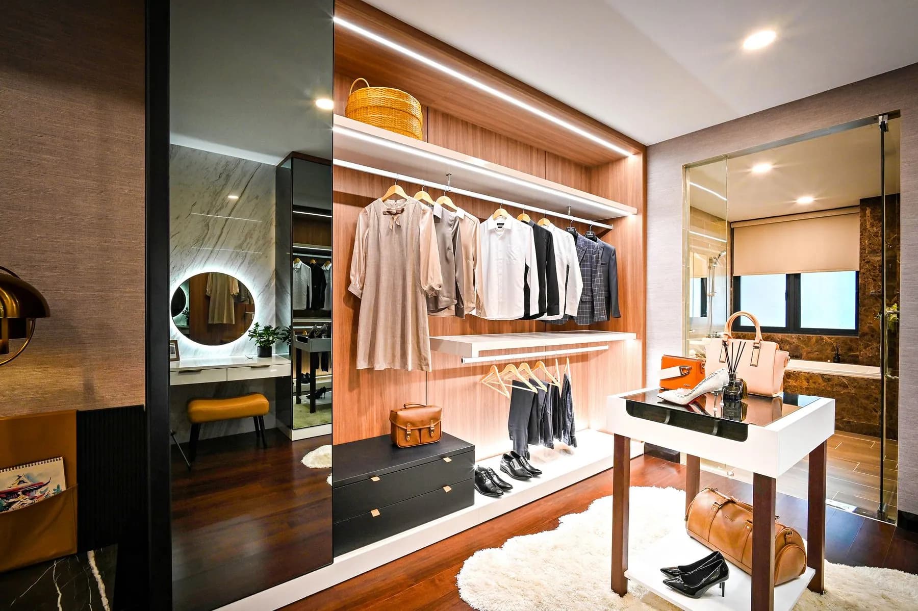Wardrobe interior in graphite textured melamine, with shelving on 32mm system holes above felt-lined drawers