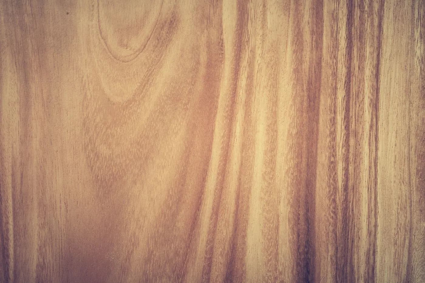 Rift-cut oak and walnut veneer samples laid out beside super-matte and gloss finish chips