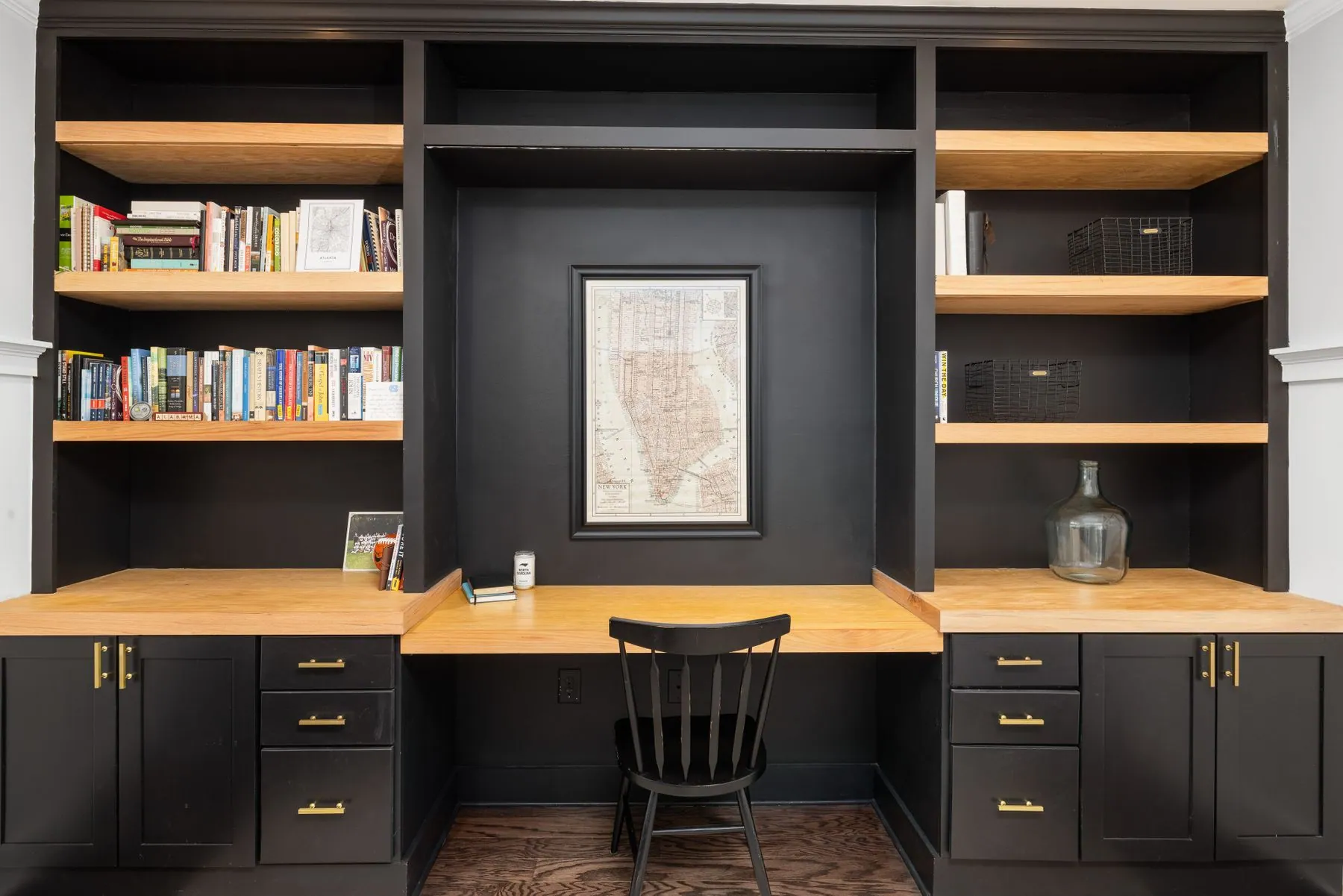Home office wall unit in walnut with a floating desk and adjustable shelving