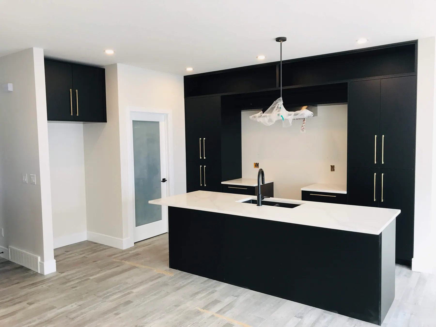 Open shelf built into the run of tall units