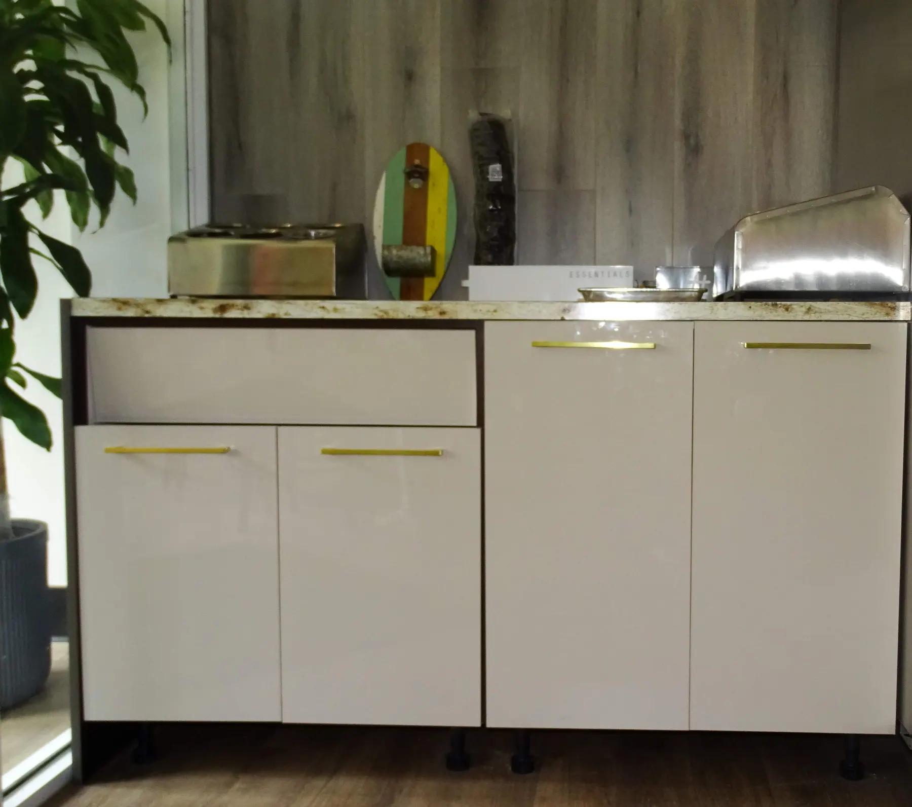 Counter detail with brass bar pulls against granite